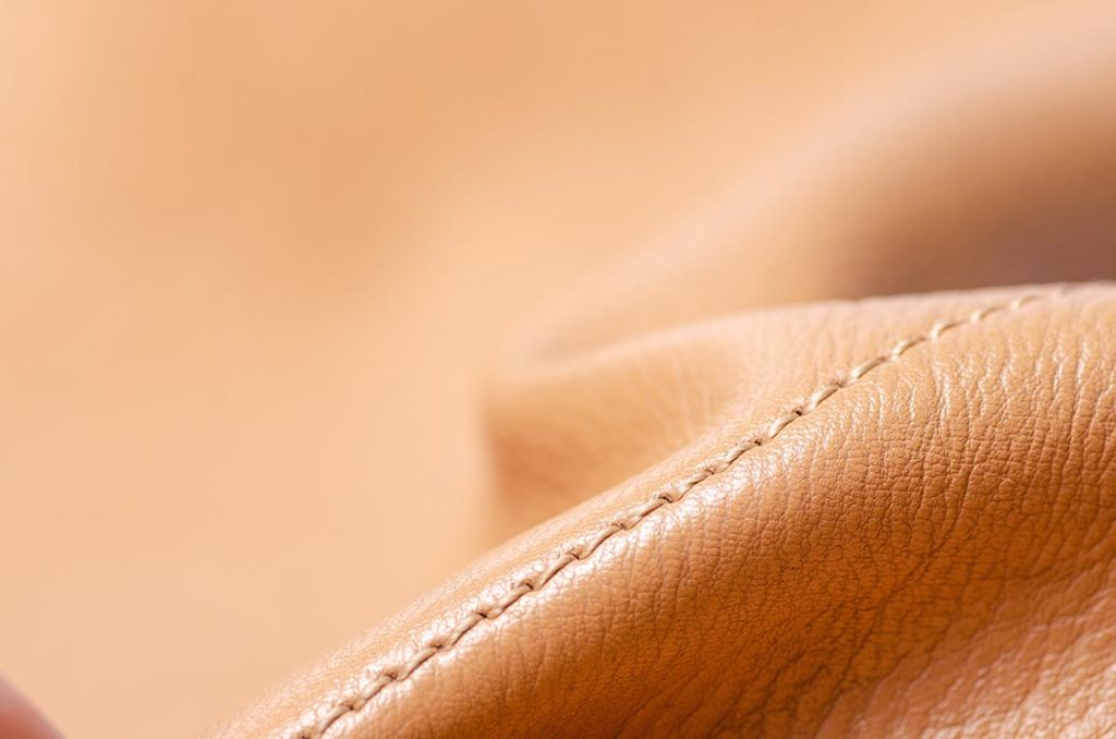 Beige yellow leather material fabric nature on blur background